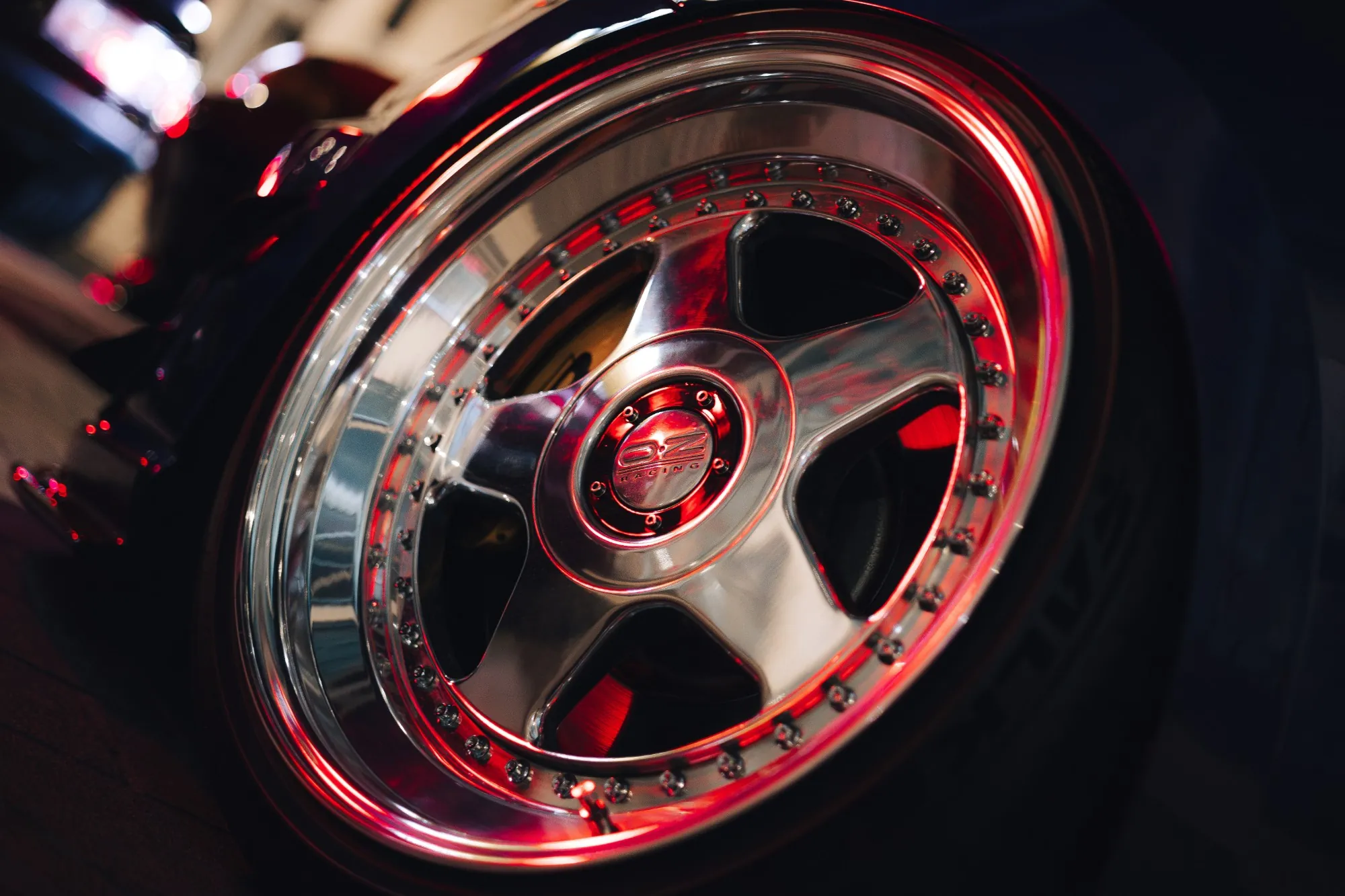 OZ Racing wheel, polished lip and red reflections